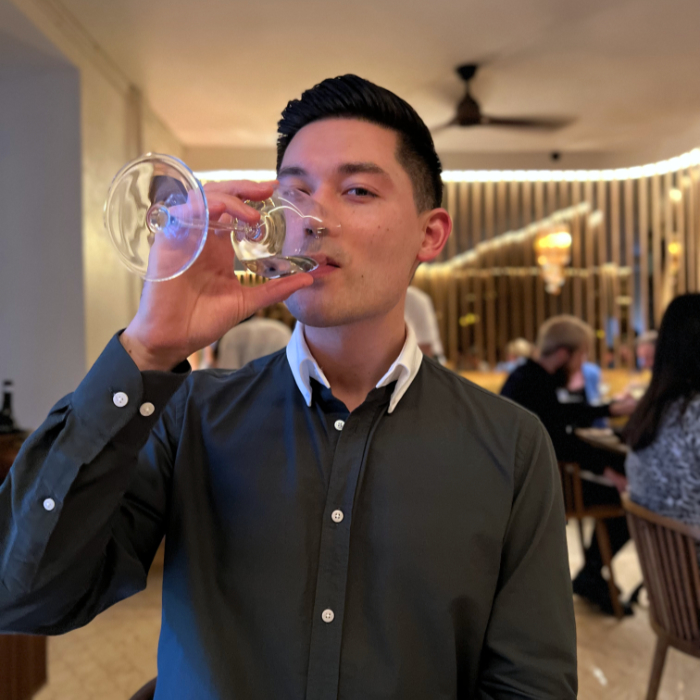 Justin drinking from a wine glass